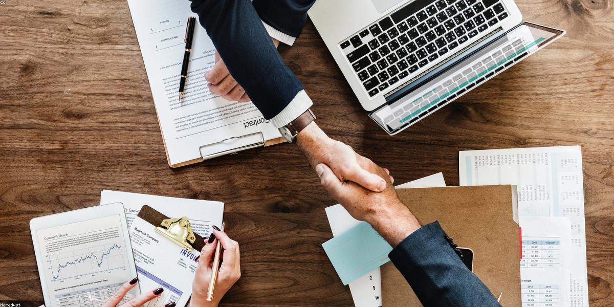 Small business owner reviewing insurance documents